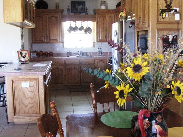 beautiful wood cabinets with tile tops