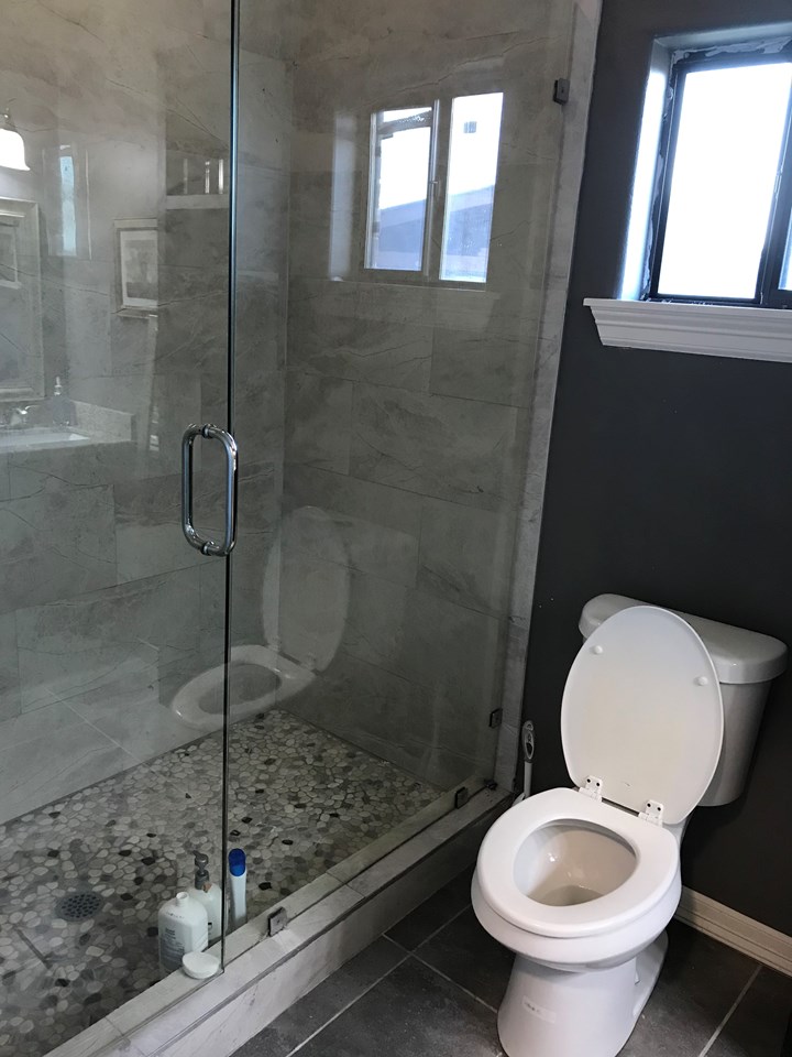 second bathroom with glass shower doors